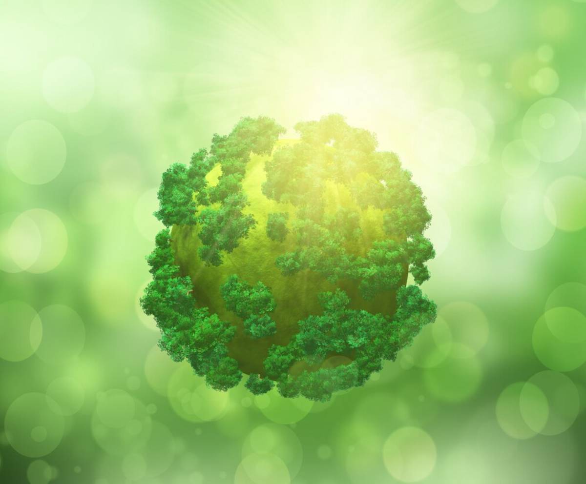 A glowing, floating green planet surrounded by a soft, blurred light with forest-like features.