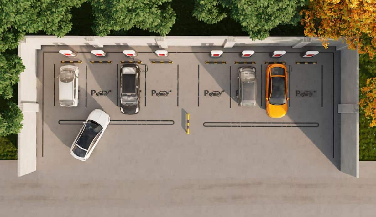 Aerial view of a parking lot with electric vehicle charging stations