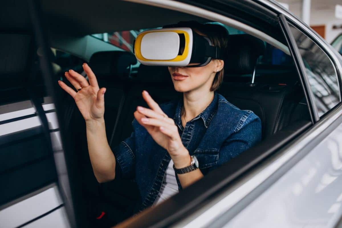 A woman gesturing enthusiastically from the back seat of a car